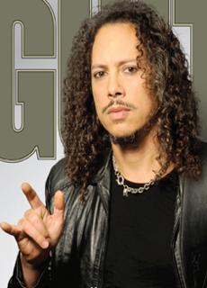 Hammett giving the devil horns with a knowing look on his face - Cover of Guitar World April, 2009