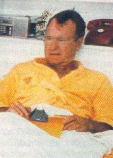 George Bush Sr. likes sleeping with Illuminati light capped pyramid.